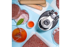 Image lab with microscope and meat in petri dishes